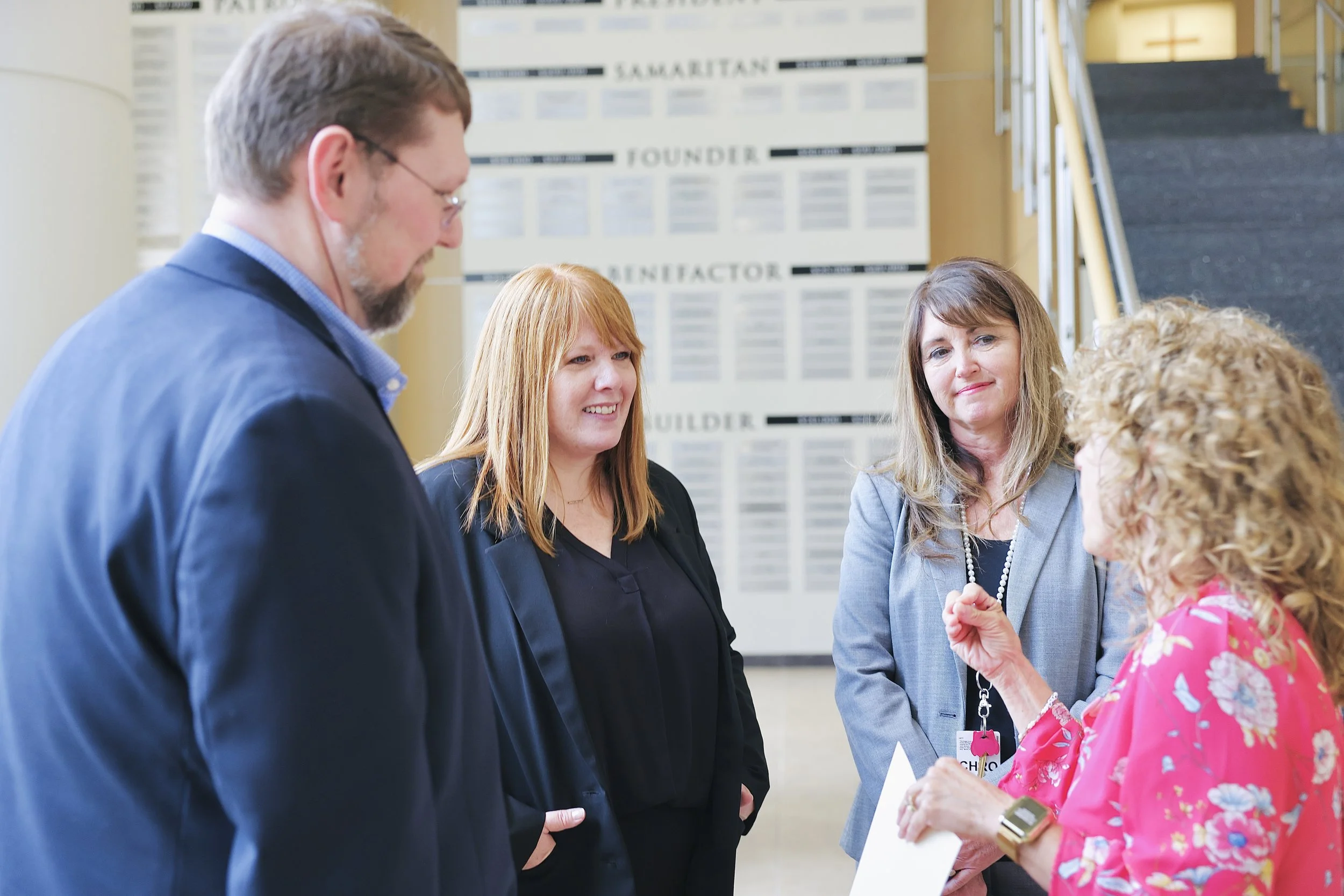 Attendees reviewing printed information at a Workforce Connections event