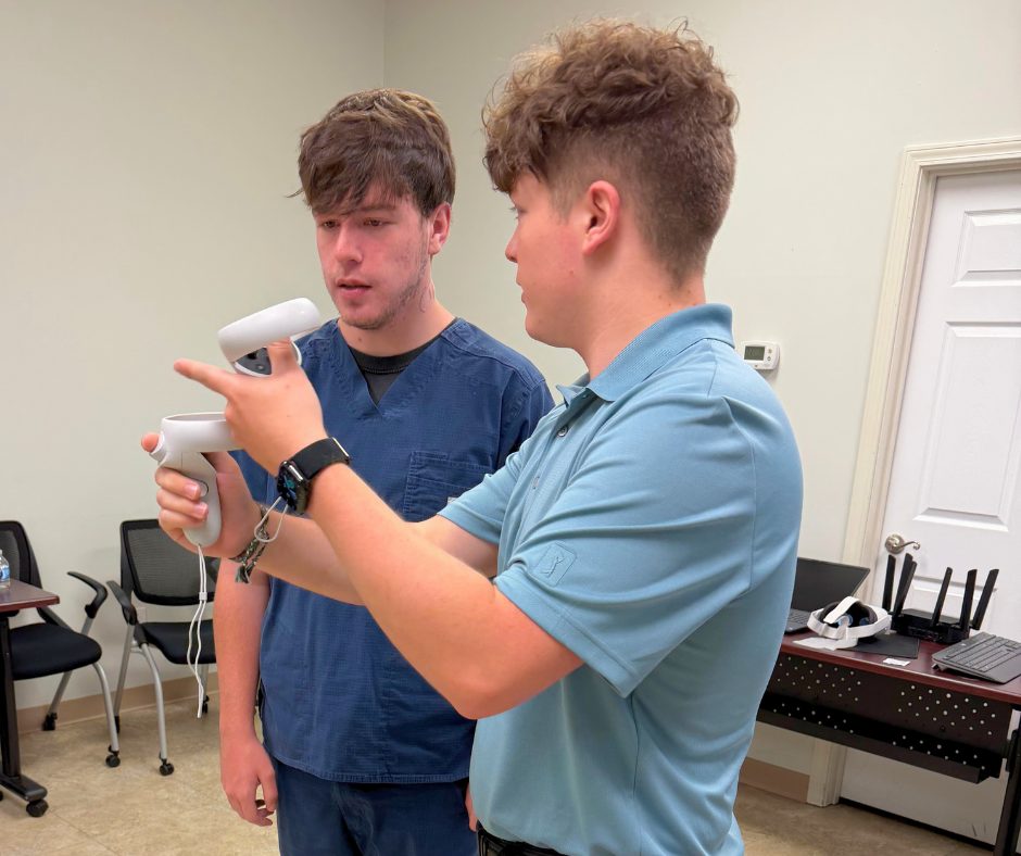 A RIVET coordinator guiding a participant holding VR controllers