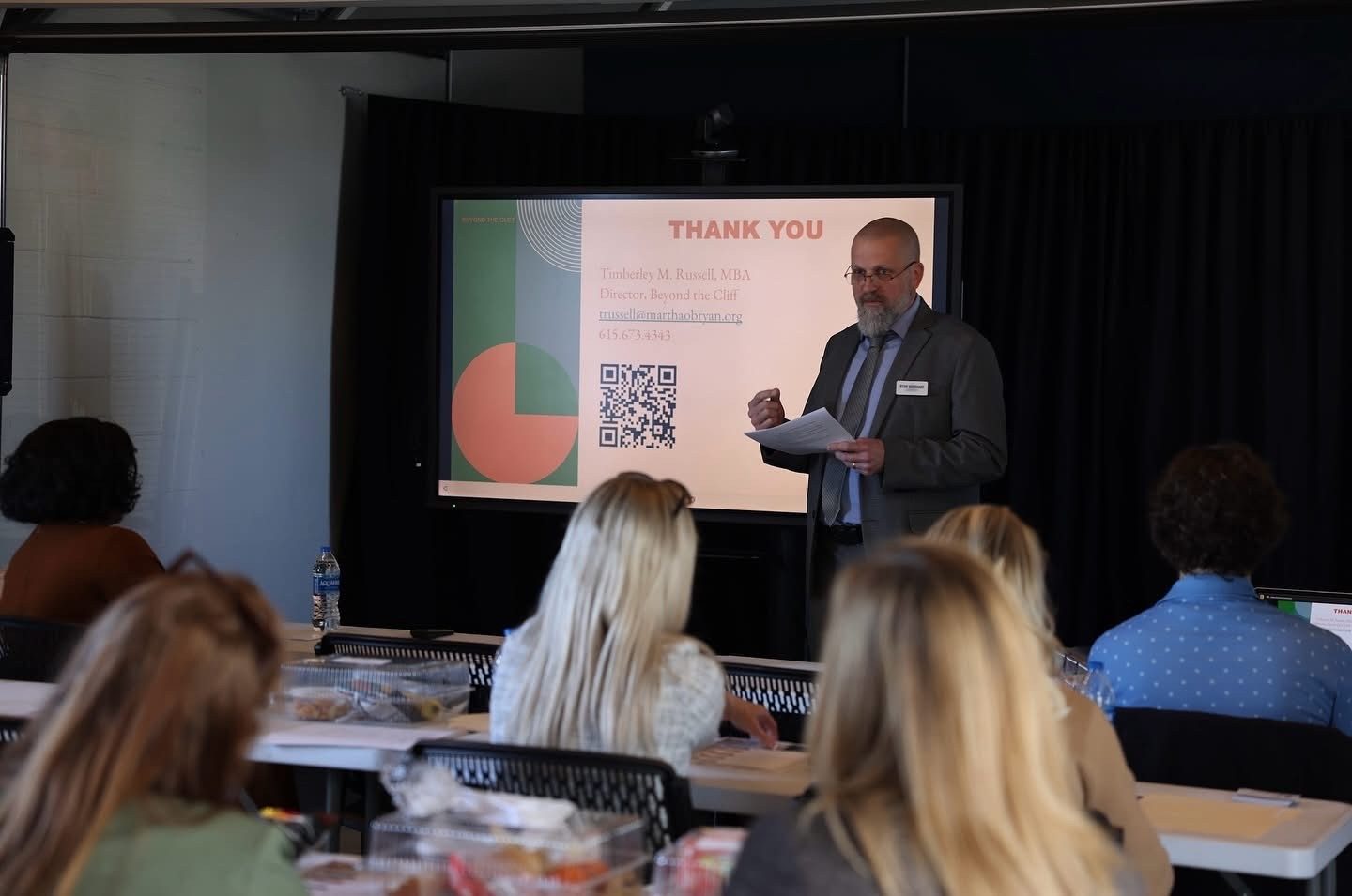 A Workforce Connections speaker presenting to local employers at an EMPOWER lunch and learn
